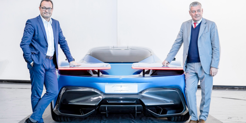 Just two execs and their hypercar. Michael Perschke and Paolo Pininfarina flank the rear end of the Pininfarina Battista.