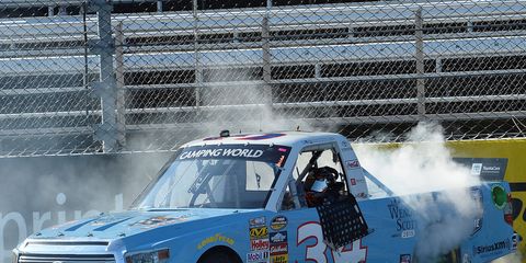 Darrell Wallace Jr. does the customary burnout after winning at Martinsville on Saturday.