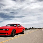 Driving the 2015 Dodge Challenger SRT Hellcat is like taming a rocket.