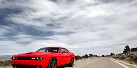 Driving the 2015 Dodge Challenger SRT Hellcat is like taming a rocket.
