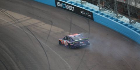 Denny Hamlin cut a tire and hit the wall after contact with Chase Elliott.