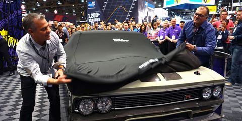 Brothers Jim (left) and Mike Ring unveil their latest creation at the 2014 SEMA Show.
