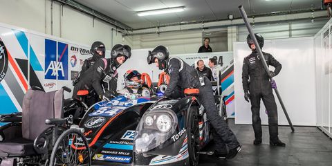 Frederic Sausset's crew gets him and the car ready for a stint in the 24 hours of Le Mans.