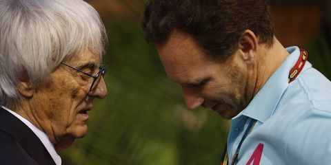 Formula One CEO and president Bernie Ecclestone talking with Red Bull team principal Christian Horner in Singapore.