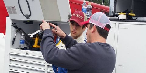 Chase Elliott, shown with Ricky Turner, is quickly becoming known as a driver who holds himself to a high standard.