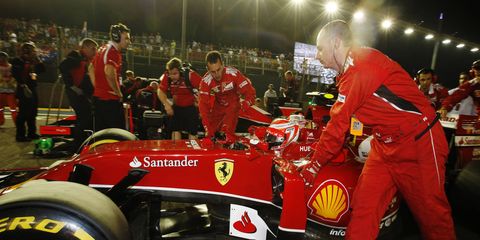 Ferrari's Formula One team on the grid at Singapore.