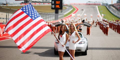 Grid girls of the Formula One U.S. Grand Prix know how to wave the red, white and blue.