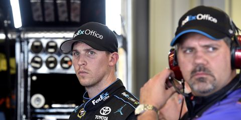 Crew chief Darian Grubb, right, is back at the helm of Denny Hamlin's NASCAR team after a six-week suspension.