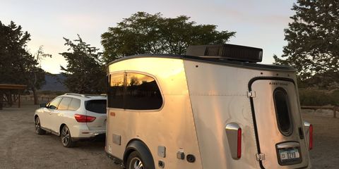 The new Airstream Basecamp sleeps two and has everything you'd want in a trailer: from shower and commode to heater, hot water, sink, propane stove and fridge. All that's missing is Wi-Fi and a TV. Pricing starts at $34,900. That's our Pathfinder tow vehicle.