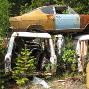 Here's a rare one: Mid-to-late-1960s Opel Kadette "Kiemencoupé" aka "Gills Coupe," perched atop a pair of vans.