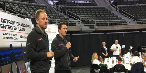 Eric Curran and Dane Cameron talk racing with Detroit Public School students at The Palace of Auburn Hills on Tuesday.