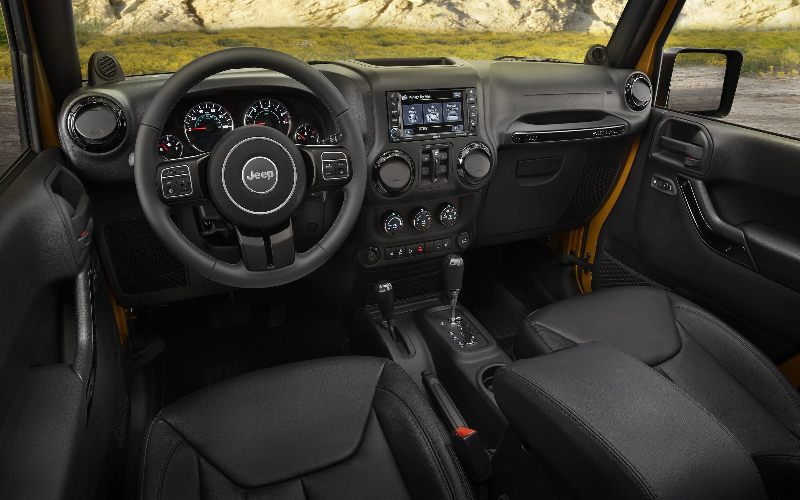 Although the 2014 Jeep Wrangler Unlimited Willys Wheeler  platform is small, it offered more than enough room for four adults and a bunch of other cargo.