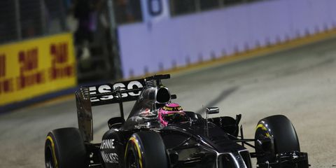 McLaren driver Jenson Button at the Singapore Grand Prix on Sunday. Amid all of the rumors going around Formula One, Button is confident he will be with McLaren for at least one more year.
