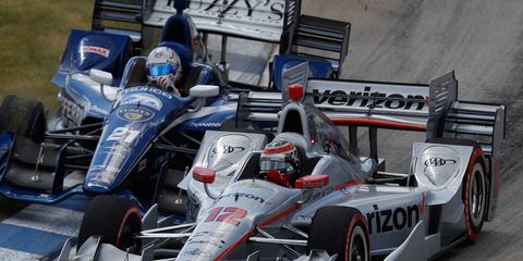 Will Power passes Josef Newgarden on his way to the victory on Belle Isle on Sunday.