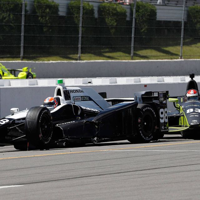 Alexander Rossi, left, and Charlie Kimball were involved in a pit-road crash that also collected Helio Castroneves at Pocono Raceway on Monday.