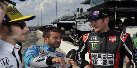 Marco Andretti, left, and Kurt Busch, right, talk prior to this year's Indianapolis 500. On Friday, Andretti addressed Kurt Busch's ex-girlfriend on Twitter after allegations of domestic abuse came to light.