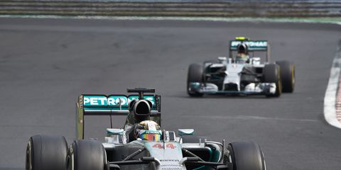 Lewis Hamilton does his best to hold off hard-charging Nico Rosberg in Hungary on Sunday.
