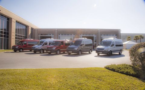 A collection of 2015 Mercedes Sprinter vans lined up outside the company's South Carolina reassembly plant.