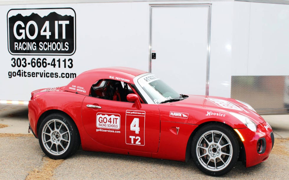 Land vehicle, Vehicle, Car, Sports car, Coupé, Pontiac solstice, Automotive design, Automotive wheel system, Wheel, Automotive exterior, Land vehicle, Vehicle, Car, Sports car, Coupé, Pontiac solstice, Automotive design, Automotive wheel system, Wheel, Automotive exterior,