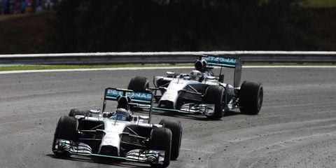 Bernie Ecclestone's plan to award double points at the Formula One finale in Abe Dhabi has given Nico Rosberg, left, a realistic shot at a championship, despite a 17-point deficit in the points.
