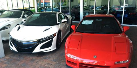 Two Acura NSXs sitting on the sales lot at Naples Motorsports in Florida.
