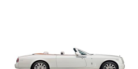 The exterior of this Maharaja inspired super-luxury vehicle dazzles in a Carrara White colour, with a Peacock emblem, the national bird of India, completing an Emerald green coachline.