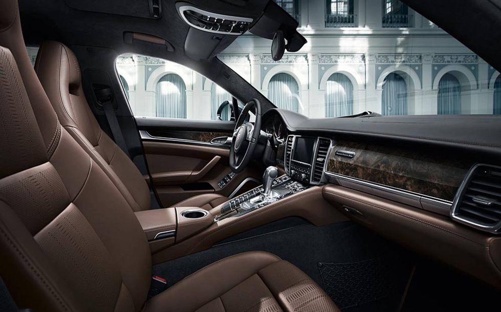 Inside, the seats and doors are swathed in chestnut brown leather with a special finish developed by Italian design studio Poltrona Frau.