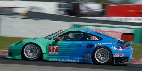 The No. 17 Porsche 911 RSR of Team Falken Tire, with drivers Wolf Henzler and Bryan Sellers, powers through practice at Canadian Tire Motorsport Park.
