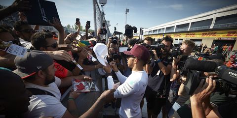 Lewis Hamilton of Mercedes-AMG meets fans and signs autographs.