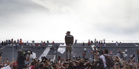 Mercedes driver Lewis Hamilton celebrates victory with fans after the race at the Canadian Grand Prix.