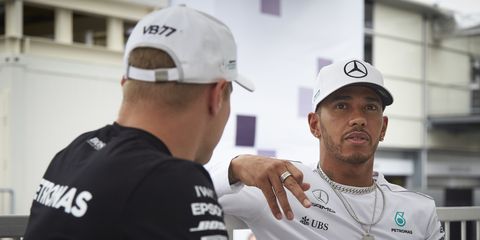 Lewis Hamilton chats with Mercedes teammate Valtteri Bottas at Baku.