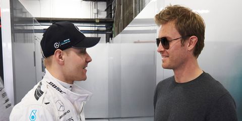 Nico Rosberg, right, shown here with Valtteri Bottas, left, seems happy in his new life out of an F1 race car.