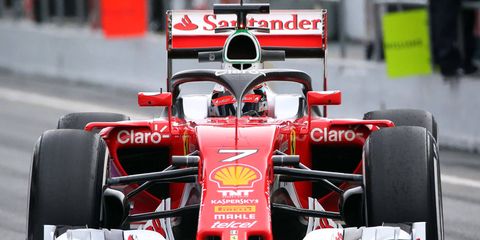 Kimi Raikkonen tests a halo-styled head-protection device on his Ferrari at Barcelona on Thursday.