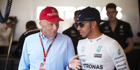 Mercedes chairman Niki Lauda, shown speaking to Lewis Hamilton, says he's heard rumors about cars with extra fuel tanks.