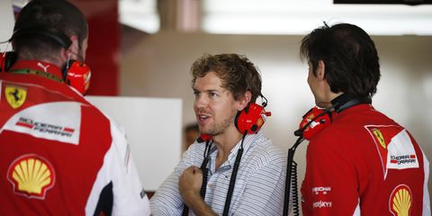 Sebastian Vettel gets to know some of his new Ferrari Formula One teammates during a test session Tuesday in Abu Dhabi.