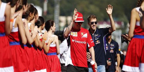 Red Bull's Sebastian Vettel with Ferrari's Kimi Raikkonen in the drivers' parade at the Russian Grand Prix.
