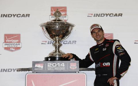 Will Power poses for a picture in front of his trophy.