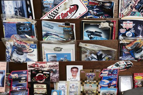 NASCAR superfan Joe Baumann has been to more than 1,000 NASCAR Cup Series races. A carpet store he owns in Erie, Pa., houses many of the treasures he's picked up along the journey.