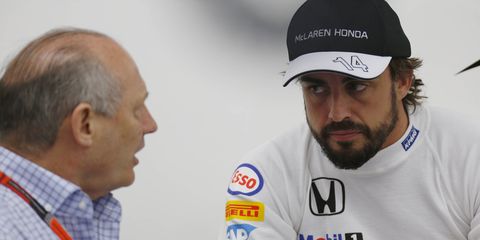 McLaren boss Ron Dennis, left, is working to get two-time F1 champion Fernando Alonso, right, a competitive Formula One ride.