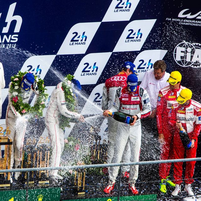 The winning Porsche team celebrates its win at Le Mans on Sunday.