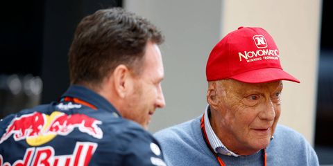 Red Bull team principal Christian Horner, left, talks with Mercedes team chairman Niki Lauda at Abu Dhabi.