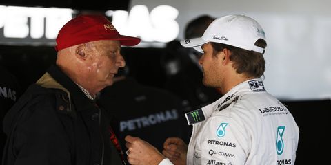 Three-time Formula One champion Niki Lauda, left, talks with Mercedes driver Nico Rosberg in Shanghai, China, this weekend.