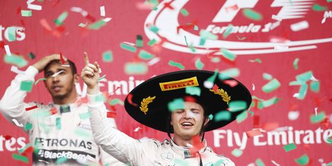 Nico Rosberg, right, celebrates his win over Lewis Hamilton, left, in Mexico City on Sunday.