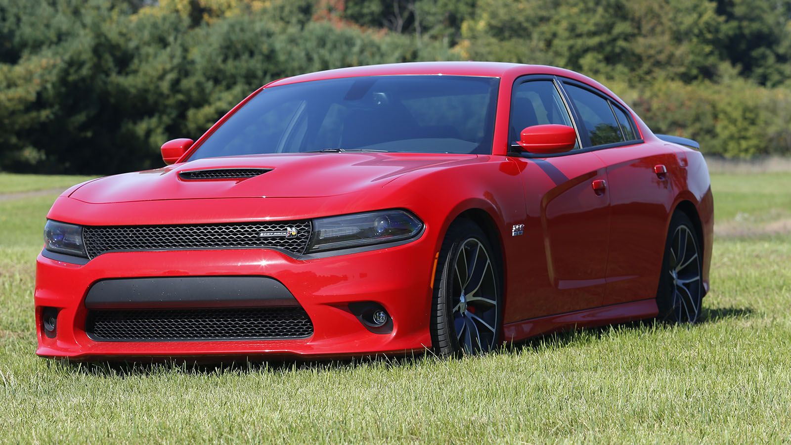 Two 1940s Plymouths and a 2016 Dodge Charger R/T Scat Pack