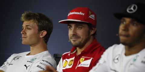 Ferrari's Fernando Alonso sits between feuding Mercedes teammates Nico Rosberg and Lewis Hamilton.