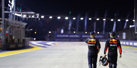 Max Verstappen and Daniel Ricciardo head back to the garage after the Singapore Grand Prix.