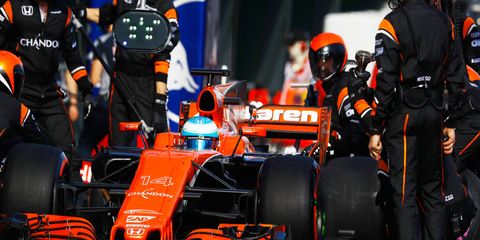 Fernando Alonso finished with the backmarkers in 14th place in the F1 opener in Melbourne.