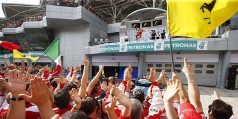 Ferrari fans cheer for Sebastian Vettel at the Malaysian Grand Prix. Race organizers signed a deal to keep the race in Malaysia through 2018.