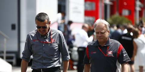 Guenther Steiner and Gene Haas walk through the paddock during the Grand Prix of Italy.