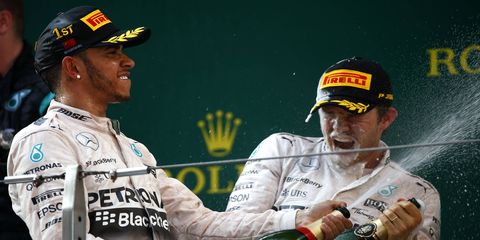 Nico Rosberg, right, said after the Formula One Chinese Grand Prix that teammate Lewis Hamilton held him back during Sunday's race.
